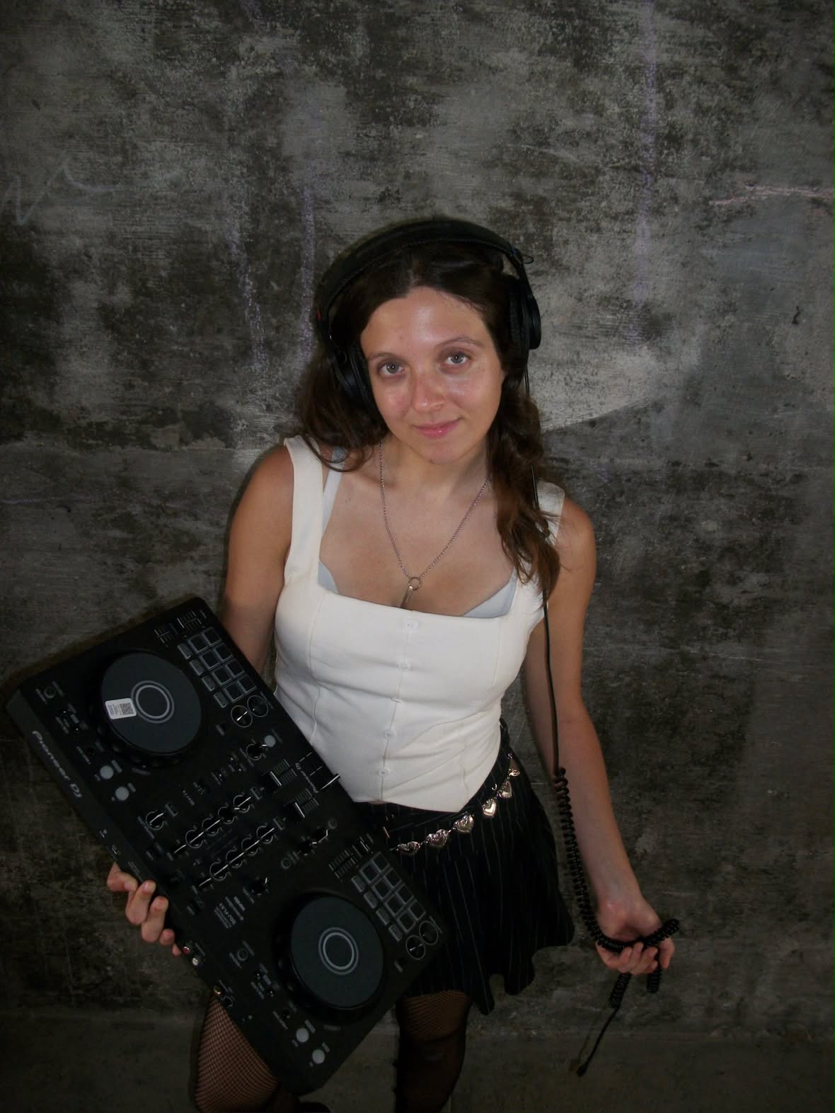 DJ Zero Gravity holding their DJ deck